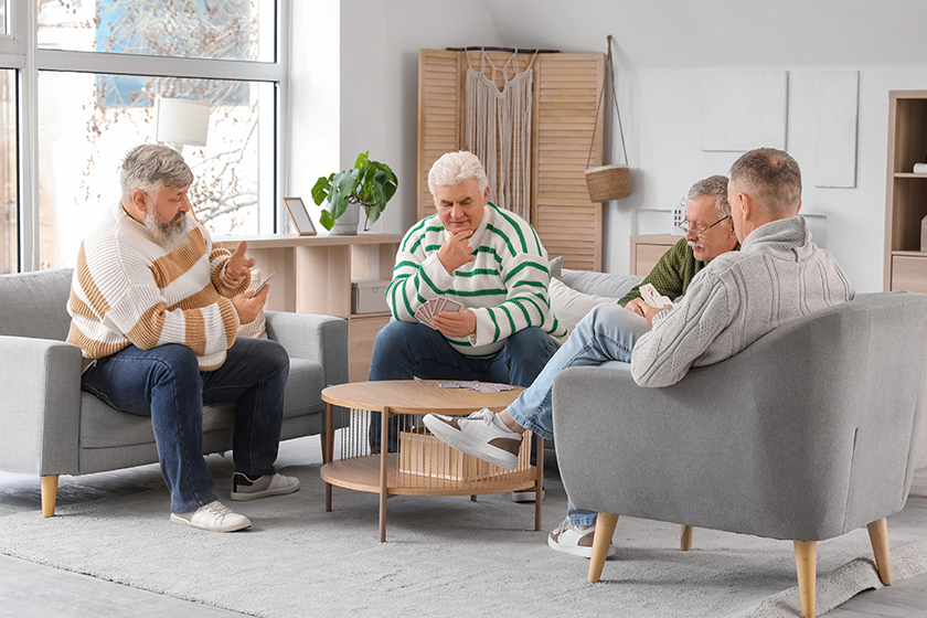 Seniors playing cards at a table